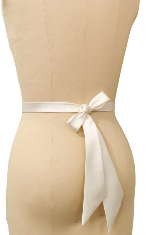 Bridal sash belt with a lavender and clear crystal appliqué that ties at the back in a bow