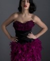Virginia short black duchess satin cocktail dress with sweetheart neckline and purple plum feathers