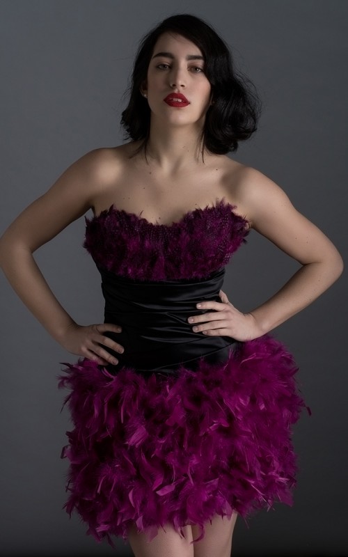 Virginia short black duchess satin cocktail dress with sweetheart neckline and purple plum feathers