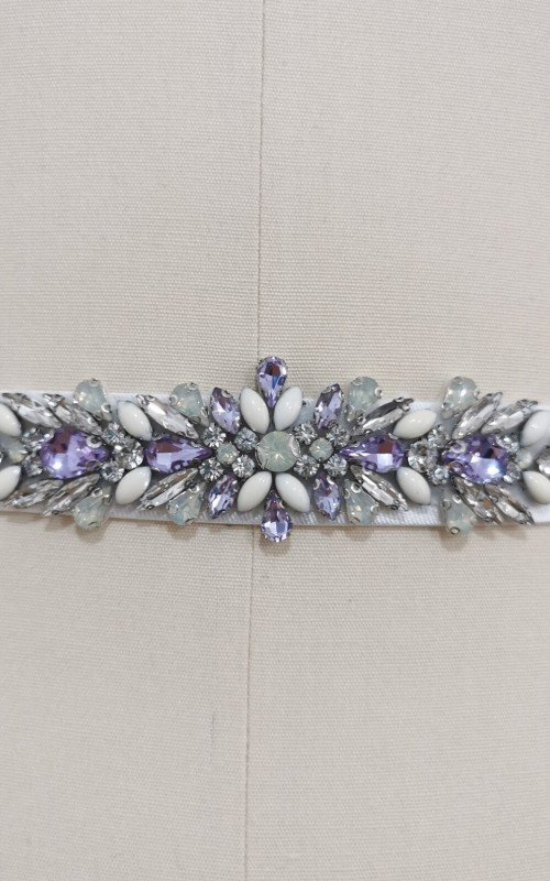 Bridal sash belt with a lavender and clear crystal appliqué that ties at the back in a bow