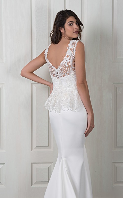 Nadine two-piece wedding dress with a plain satin fishtail gown and a detachable beaded lace top with a peplum