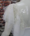White flutter tulle detachable bridal sleeves and straps with beaded lace at the shoulder