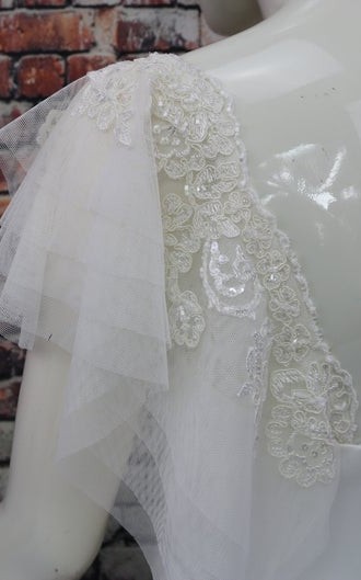 White flutter tulle detachable bridal sleeves and straps with beaded lace at the shoulder