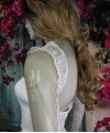 Ivory illusion tulle detachable long bridal sleeves and straps with a lace edge along the arm