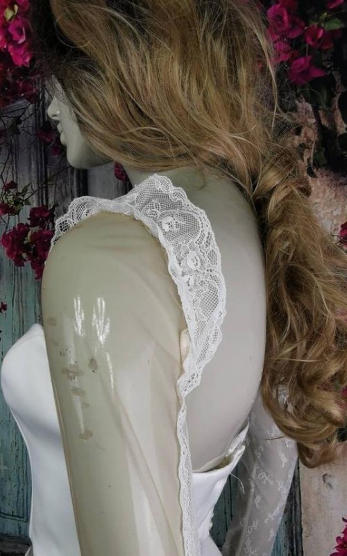 Ivory illusion tulle detachable long bridal sleeves and straps with a lace edge along the arm