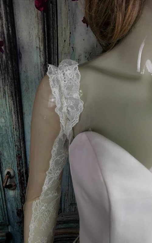 Ivory illusion tulle detachable long bridal sleeves and straps with a lace edge along the arm