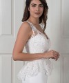 Nadine two-piece wedding dress with a plain satin fishtail gown and a detachable beaded lace top with a peplum
