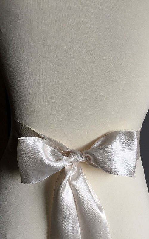 Ivory satin bridal sash belt with a satin and lace bow and silver-edged trim