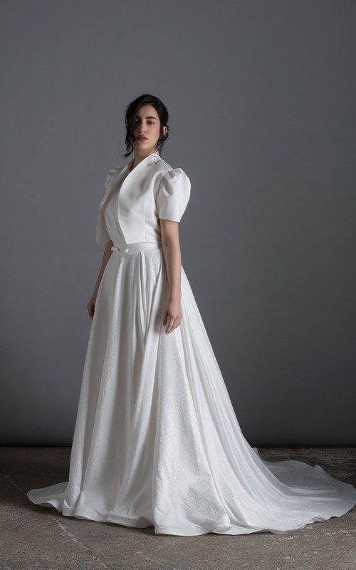 Bride wearing the Lorenza one-shoulder ballgown wedding dress with crystal strap and train, ivory, handmade in London