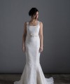 Bride wearing the Laura mermaid wedding dress in ivory duchess satin with white Italian lace and chapel train, handmade in London