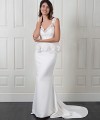 Nadine two-piece wedding dress with a plain satin fishtail gown and a detachable beaded lace top with a peplum