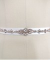 Bridal sash belt with a rose gold crystal and pearl appliqué that ties at the back in a bow