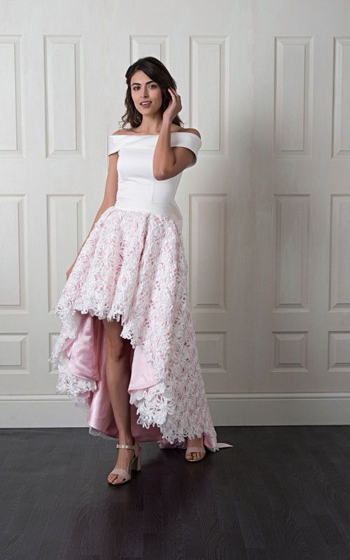 Nancy off-shoulder wedding dress with a smooth satin bodice and a high-low 3D floral lace skirt over blush lining with a bow back
