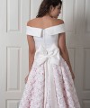 Nancy off-shoulder wedding dress with a smooth satin bodice and a high-low 3D floral lace skirt over blush lining with a bow back