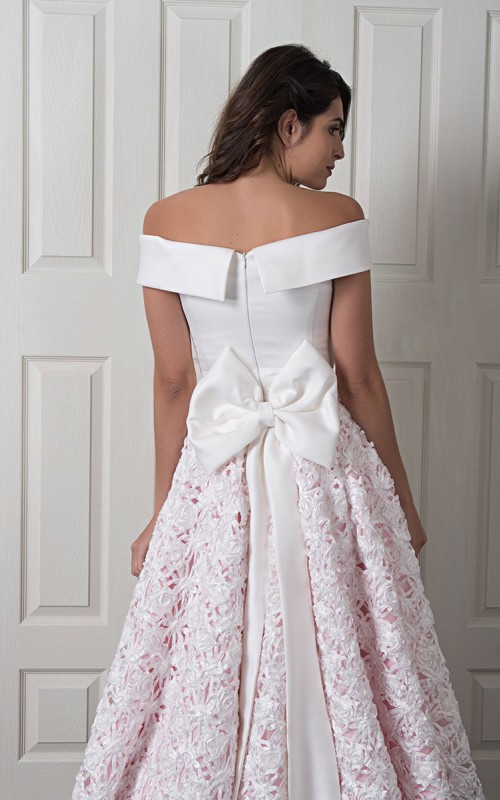 Nancy off-shoulder wedding dress with a smooth satin bodice and a high-low 3D floral lace skirt over blush lining with a bow back