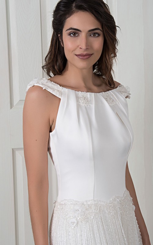 Natalie wedding dress with a satin bateau-neck bodice, open V-back and a long pleated beaded lace skirt