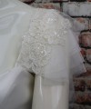 White flutter tulle detachable bridal sleeves and straps with beaded lace at the shoulder