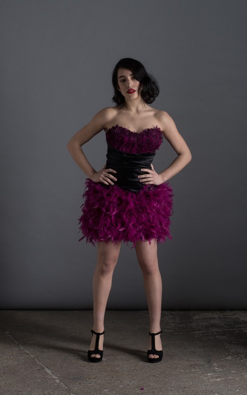 Virginia short black duchess satin cocktail dress with sweetheart neckline and purple plum feathers