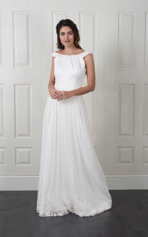 Natalie wedding dress with a satin bateau-neck bodice, open V-back and a long pleated beaded lace skirt