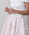 Nancy off-shoulder wedding dress with a smooth satin bodice and a high-low 3D floral lace skirt over blush lining with a bow back