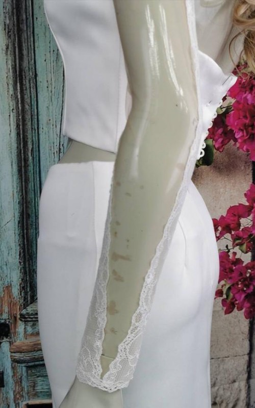Ivory illusion tulle detachable long bridal sleeves and straps with a lace edge along the arm