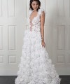 Nadia boho A-line wedding dress covered in 3D fabric flowers with a deep V nude illusion bodice