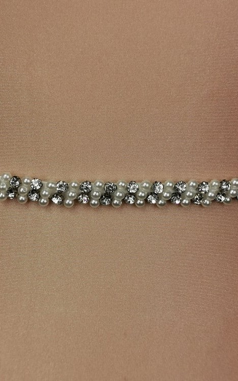 Slim ivory bridal belt covered in hand-sewn crystals and pearls with a covered-button back