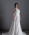 Bride wearing the Lorenza one-shoulder ballgown wedding dress with crystal strap and train, ivory, handmade in London