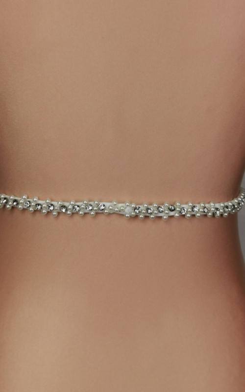 Slim ivory bridal belt covered in hand-sewn crystals and pearls with a covered-button back