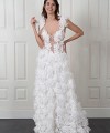 Nadia boho A-line wedding dress covered in 3D fabric flowers with a deep V nude illusion bodice