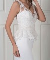 Nadine two-piece wedding dress with a plain satin fishtail gown and a detachable beaded lace top with a peplum