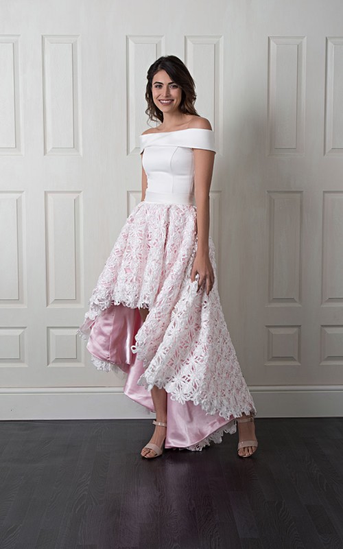 Nancy off-shoulder wedding dress with a smooth satin bodice and a high-low 3D floral lace skirt over blush lining with a bow back