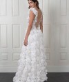 Nadia boho A-line wedding dress covered in 3D fabric flowers with a deep V nude illusion bodice